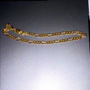 Small gold figaro bracelet. 12ct gold
